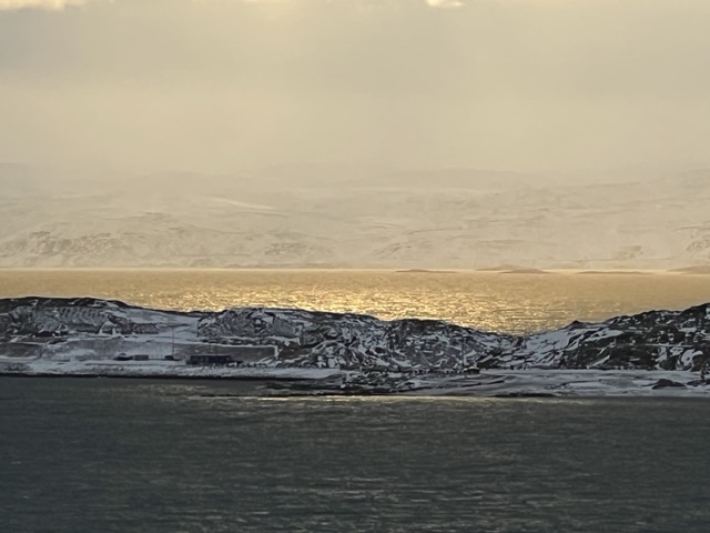 Looking across the harbor in Iqaluit and further across Frobisher Bay to Meta Incognita Peninsula as the sun gets low.

